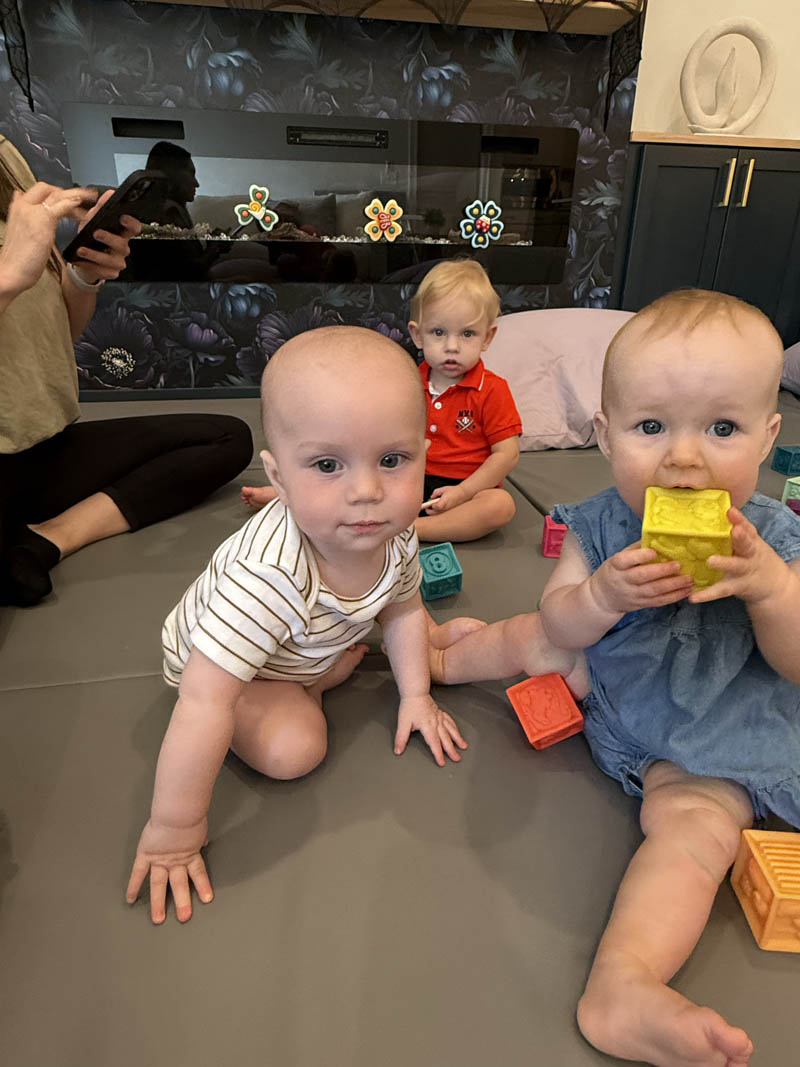 toddlers playing with building blocks