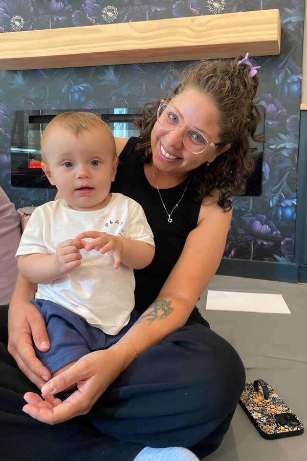 Miss Lee in private guidance session with baby